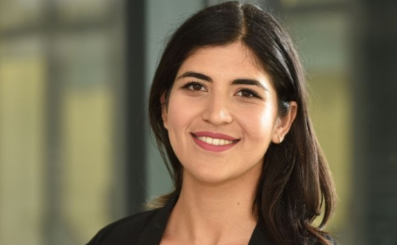 Shivangi smiling at the camera in a professional headshot